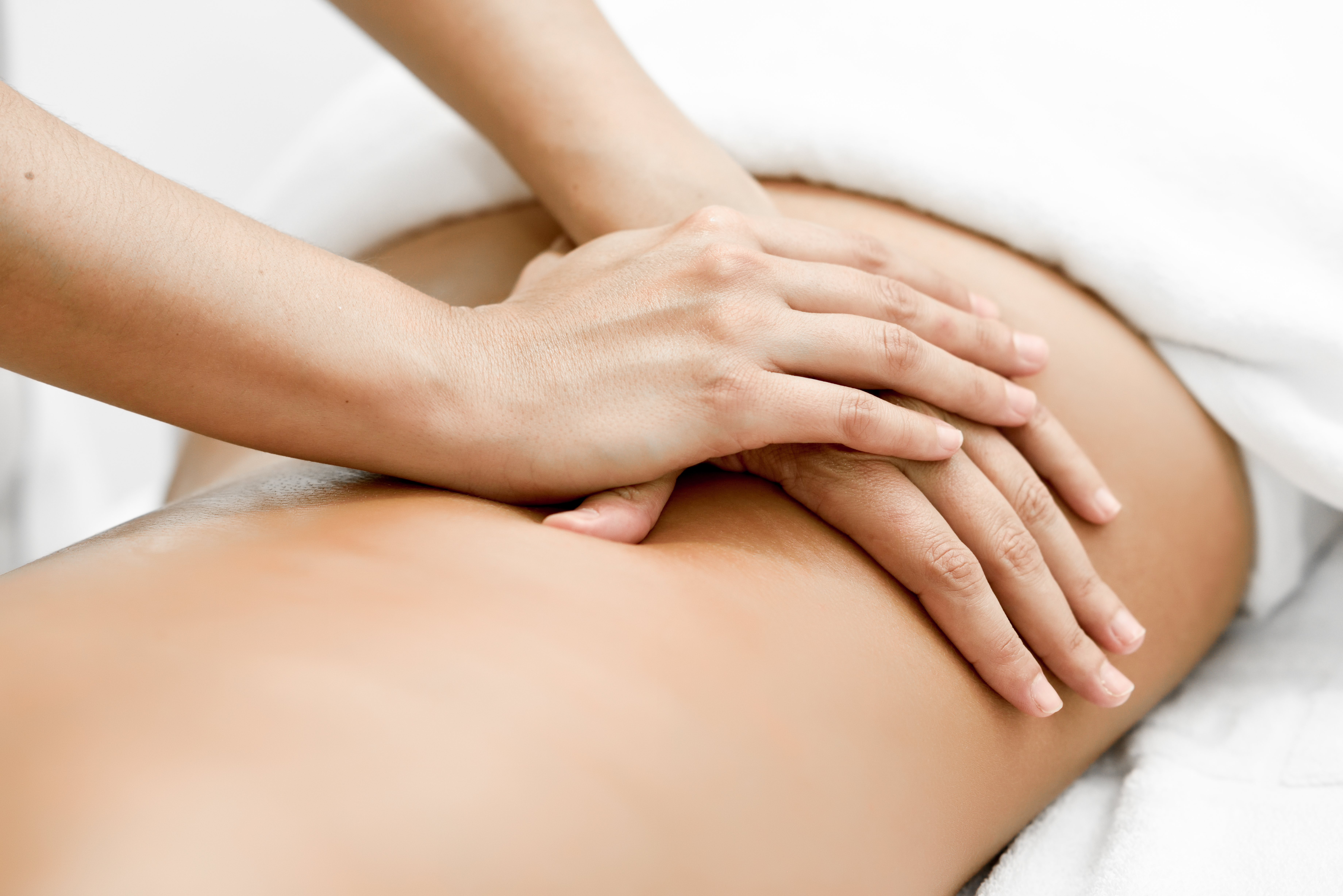 young-woman-receiving-back-massage-spa-center (1)